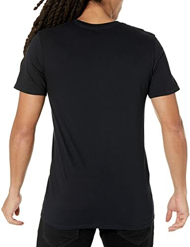 Person wearing a black t-shirt seen from the back.