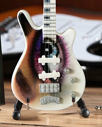 Custom painted guitar with an eye design on the body.