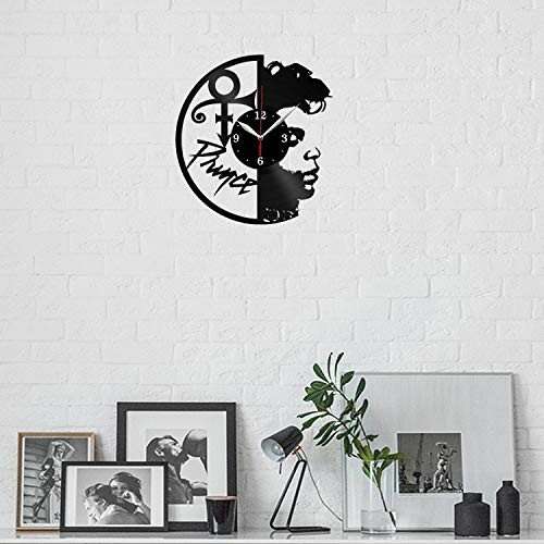 Silhouette wall clock with artistic design on white brick wall.