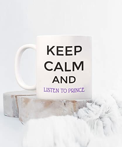 White mug with 'Keep Calm and Listen to Prince' text