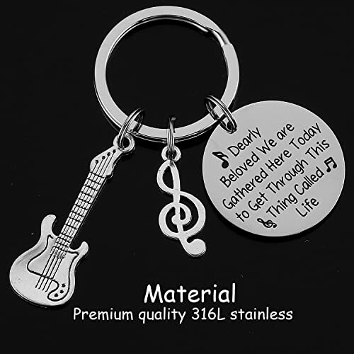 Keychain with guitar, treble clef, and engraved disc with lyrics.