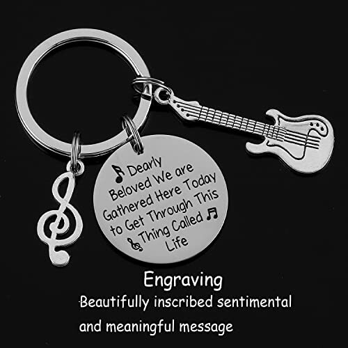 Keychain with guitar, music note, and engraved message.