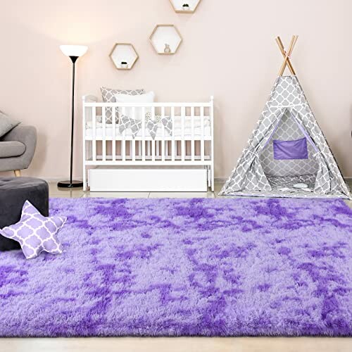 Nursery room with purple rug, crib, and play tent.