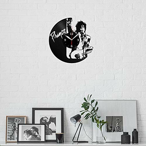 Vinyl record wall clock with silhouette design on brick wall.