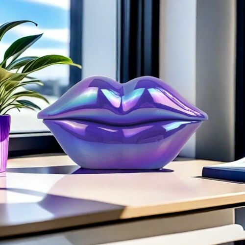 Shiny purple lips sculpture on a desk near a window.