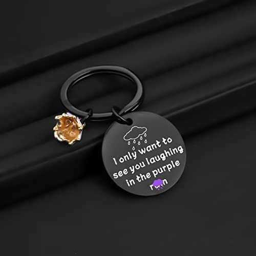 Keychain with 'I only want to see you laughing in the purple rain' message