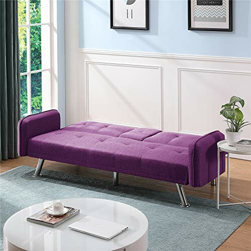 Modern purple sofa bed in a living room with a potted plant and coffee table.