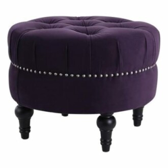 Purple tufted ottoman with studded details and black legs