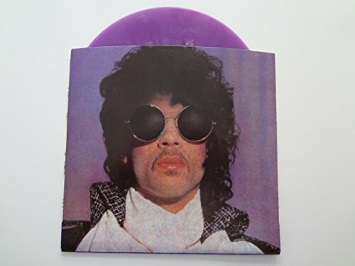 Vinyl record cover with a person wearing sunglasses.