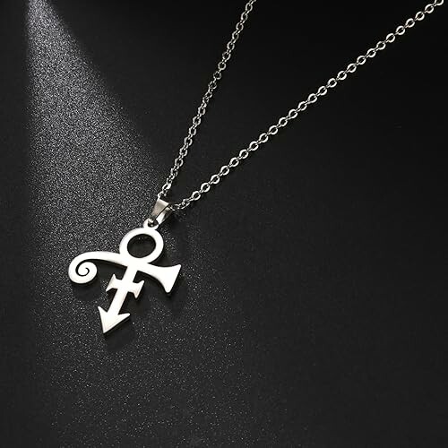 Silver necklace with unique symbol pendant on black background