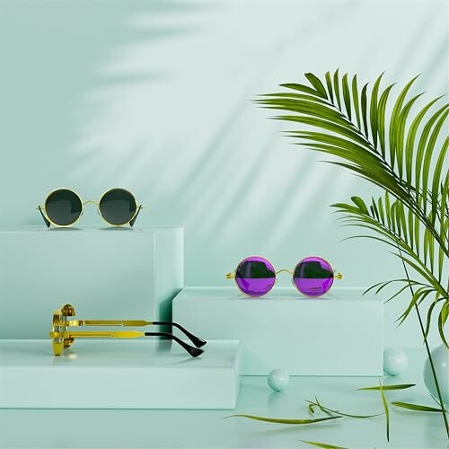 Sunglasses displayed on mint green platforms with palm leaf.