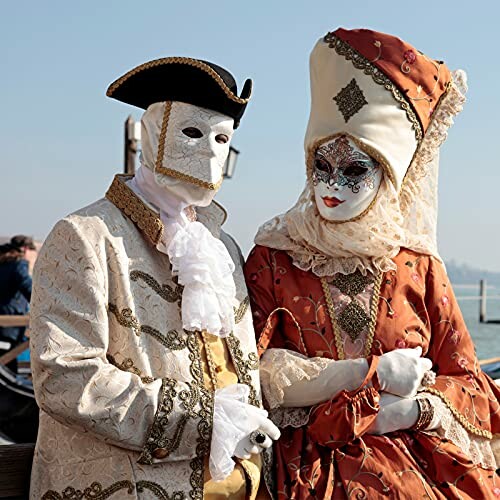 Two people in Venetian costumes and masks