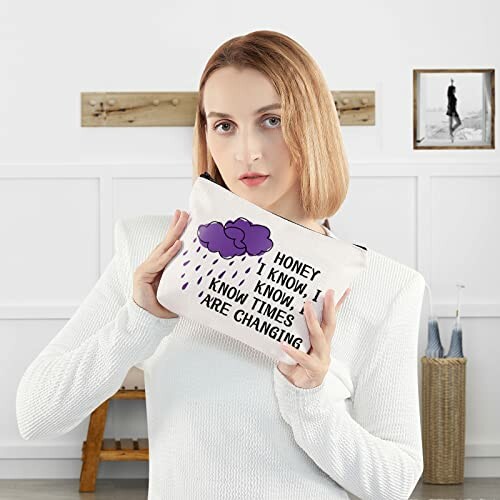 Woman holding a bag with a quote and cloud illustration.