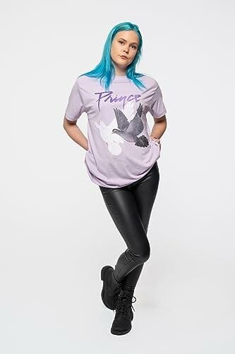 Woman with blue hair in a purple shirt and leather pants