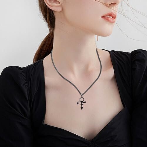 Woman wearing a black symbol necklace